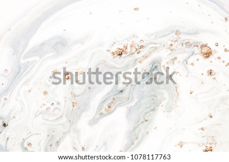 Marbleized effect. Natural Luxury. Liquid marble pattern with golden powder. Ancient oriental drawing technique.