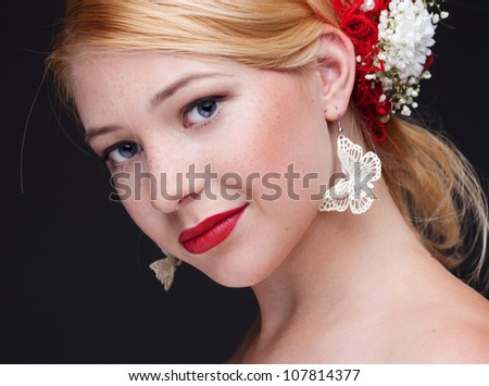 beautiful woman with bright make-up on black background