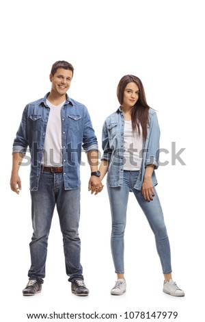 Full length portrait of a young couple holding hands isolated on white background
