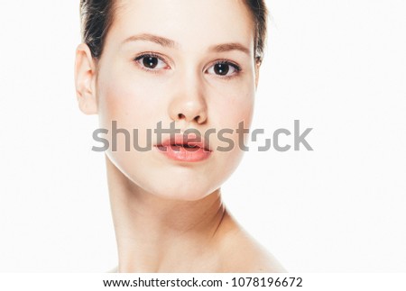 Young girl with healthy skin headshot isolated on white