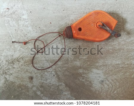 Chalk Reel  in orange cartridges. Used to create a straight line.