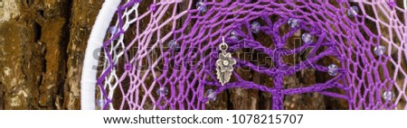 Banner of Dreamcatcher with bat made of feathers leather beads and ropes, hanging