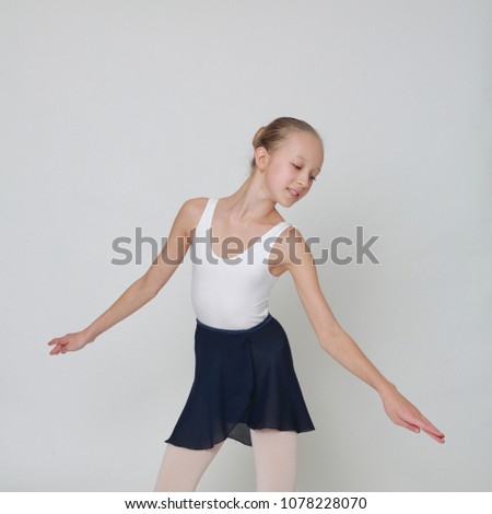 Beautiful little ballerina in studio