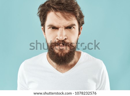    angry man with beard, portrait                            