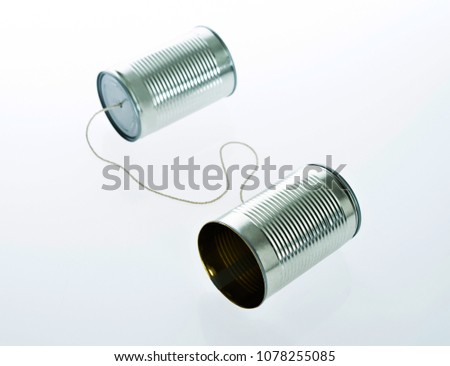 Tin cans telephone isolated on white background