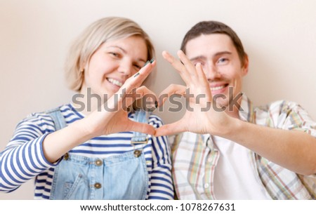 Photo of woman and man sitting on floor
