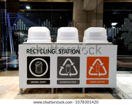 Recycle bins, categorized by materials, sign on each bin is easy for people to understand