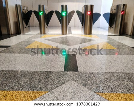 automatic gate using key card for screening outside people from blending in. green color to get through, red not to pass, security checking concept