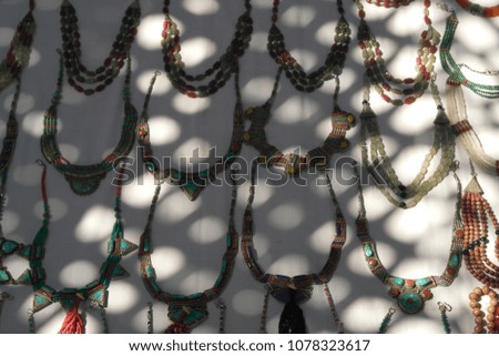 Sets of jewelry in solar patches of light
