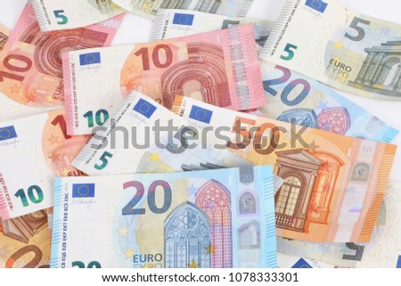 a heap of different euros are lying in the studio