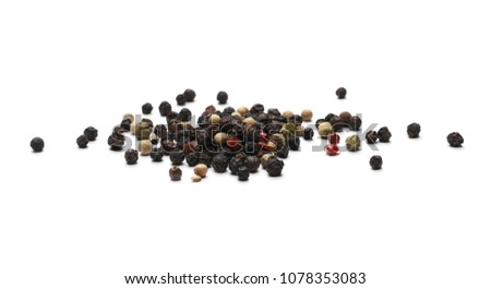 Colorful and unground pepper pile isolated on white background