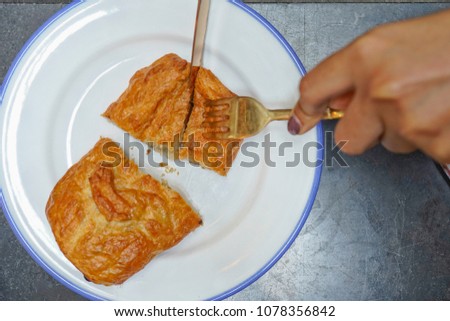 top view women eating puff pie.