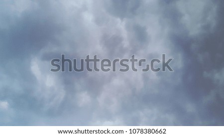 Blurry images of the sky before the thunderstorm can be made in the background.