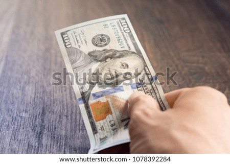 Flying money on  Wooden floor background