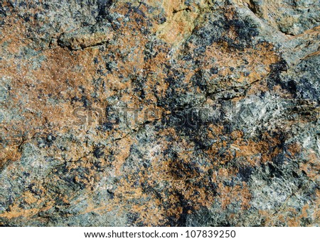 Different in color and a structure a stone surface close up