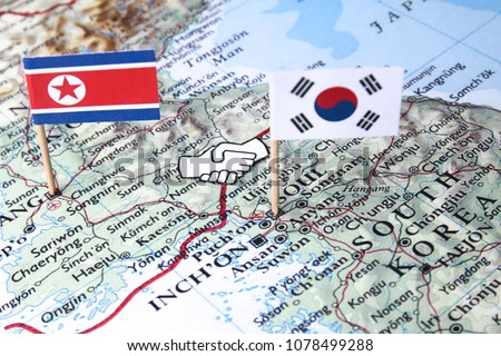 Concept of unity handshake at the Panmunjom border between North and South Korea Royalty-Free Stock Photo #1078499288