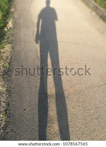 Long Shadow of a Walking Man