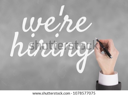 Hand interacting with were hiring business text against grey background