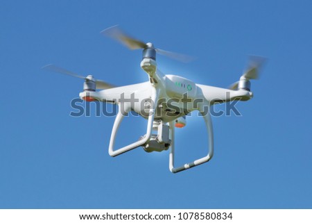 Drone quad copter with high resolution digital camera on the sky