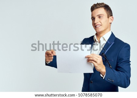 sheet of paper, suit, man                           