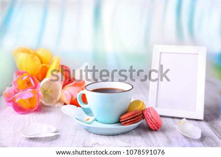 Travel resort concept.Hot drink coffee mug with macarons and empty frame space for text.Morning breakfast.