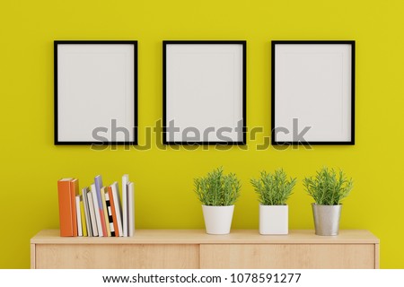 Blank three picture frame for insert text or image inside on the wall in living room. 