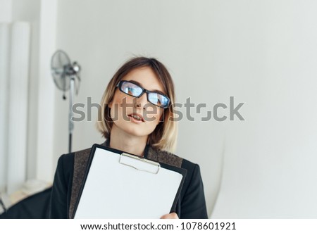  Business woman with glasses, documents, office                              