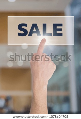 Hand interacting with sale business text against blurred background