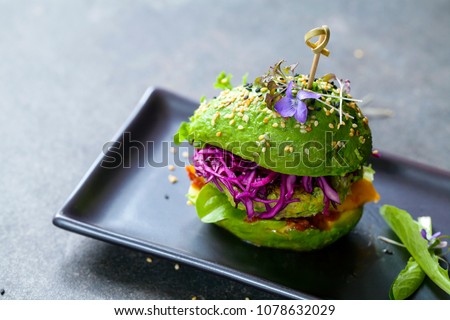 Avocado sandwich with green vegan burger,  roast yellow pepper and pickled red cabbage Royalty-Free Stock Photo #1078632029