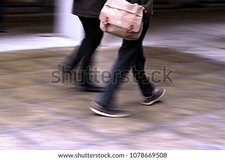 Street shot of moving feet