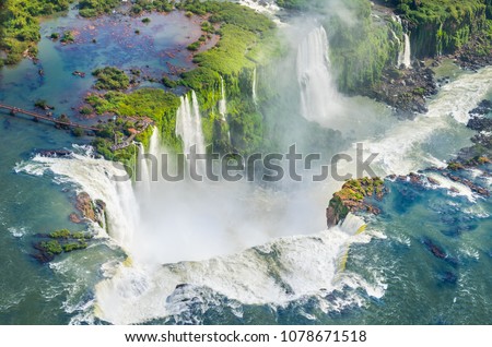 Beautiful aerial view of Devil's Throat in Iguazu Falls from helicopter ride  - One of the Seven Natural Wonders of the World - Foz do Iguaçu, Brazil Royalty-Free Stock Photo #1078671518