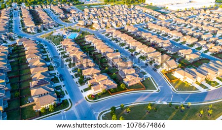 Suburb housing neighborhood Homes in suburbia - aerial drone view - above Austin , Texas , USA perfect cubed square houses living area in real estate suburban community at sunset summer