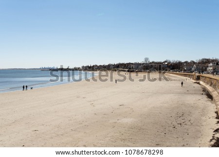 beach in Massachusetts north of Boston with the city in the distant background