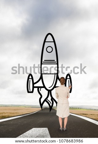Business woman drawing a rocket on the road