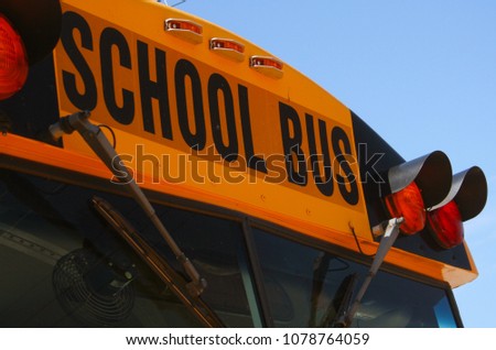 School Bus - Close-up of Sign With Blue Sky Background 