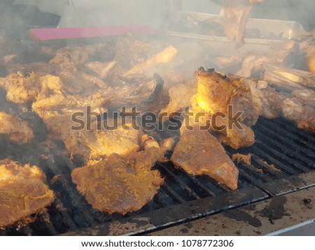 Grilling chicken, beef and lamb at a restaurant