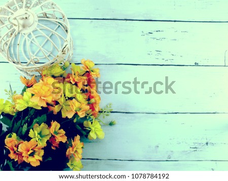 flowers bouquet and bird cage with copy space background