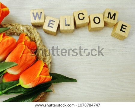 welcome wooden cube top view on wooden background