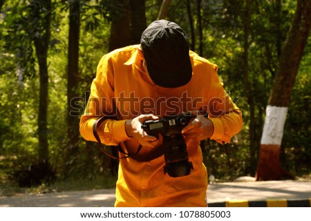 A photographer taking photo during the time of holiday in Elephanta cave Mumbai in India. 