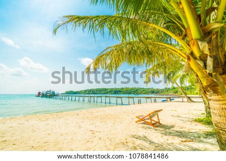 Chair on the Beautiful tropical beach and sea with coconut palm tree in paradise island for travel and vacation