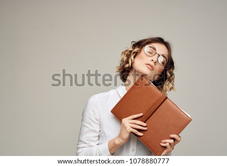 woman with a notepad brown...                              
