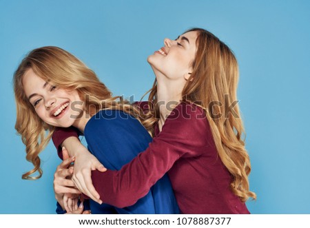 girlfriend, hugging, blue background, fashion                  