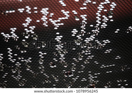 Blurred Water droplets on the glass with a colored background