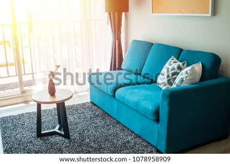 Living room home design for contemporary layout and blue couch with good balance for relaxation and living well.