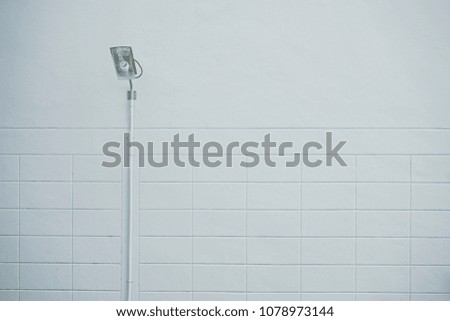 Outdoor bulb on white wall background, minimal