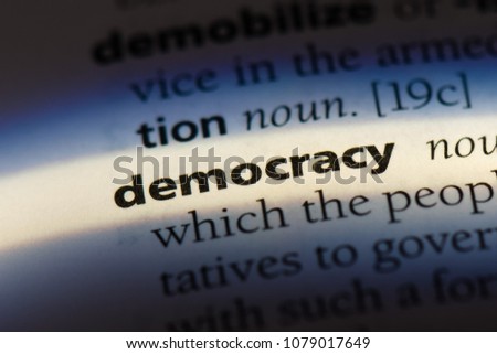 democracy word in a dictionary. democracy concept Royalty-Free Stock Photo #1079017649