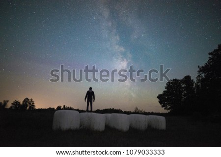 Person standing under the milky way