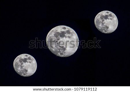 Three moon in night sky