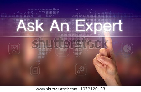 A hand selecting a Ask an Expert business concept on a clear screen with a colorful blurred background.