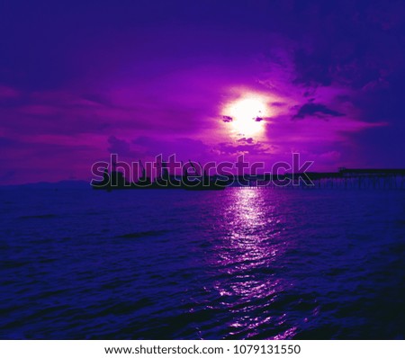 Purple sky, blue sea at sunset